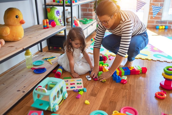 Mom and child controlling toy clutter
