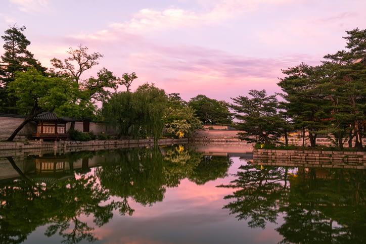 photo of a lakeside scene at sunset