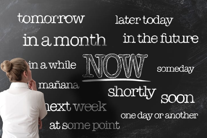 expressions of procrastination on a chalkboard